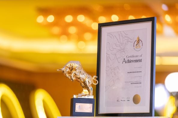 Golden Bull Award 2022 trophy and certificate celebrating achievement at Zolano event.