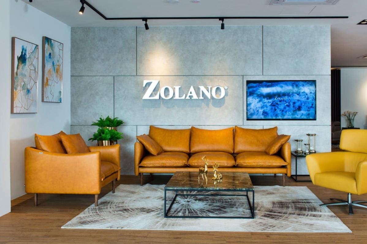 Modern office reception area with Zolano branding and stylish seating arrangement.