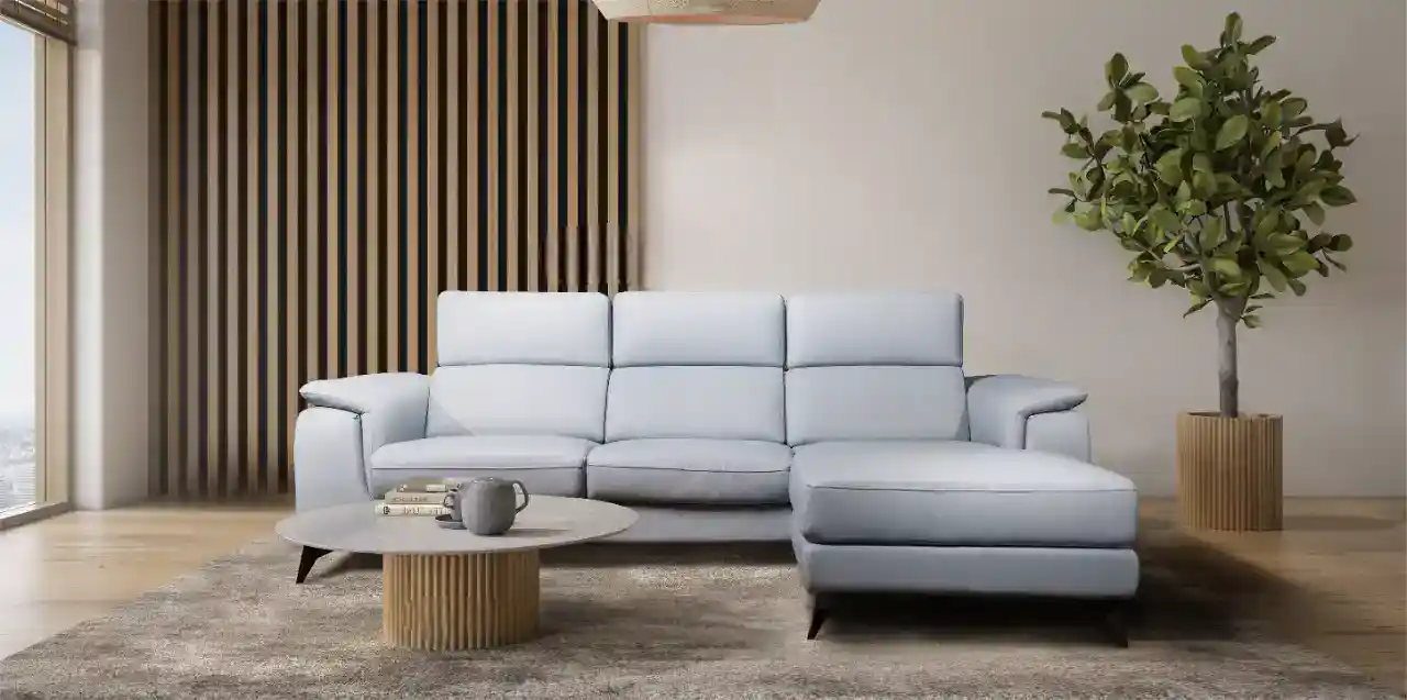 A modern white sofa with wooden accents in a stylish living room setting.