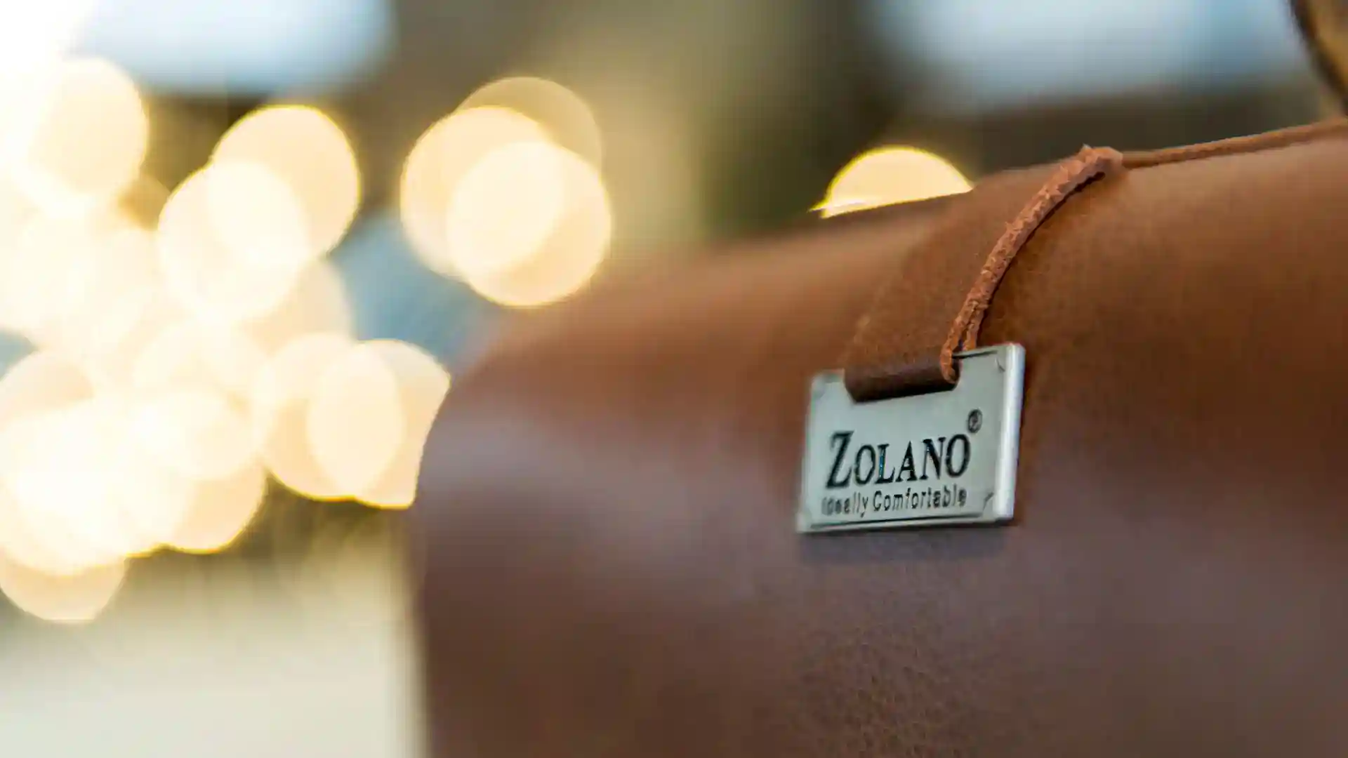 A professional leather briefcase with a Zolano tag, showcasing craftsmanship and quality.