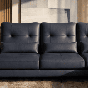 Modern navy blue leather sofa in stylish living room with wooden accents.