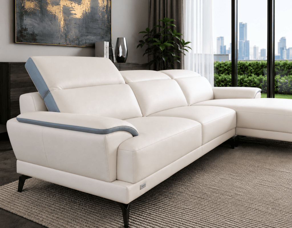 Modern white leather sofa with grey accents in stylish living room with city view.
