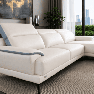 Modern white leather sofa with grey accents in stylish living room with city view.