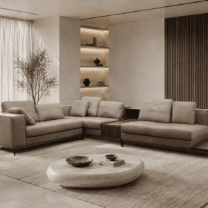 Modern living room with beige sofas, round coffee table, and natural light.