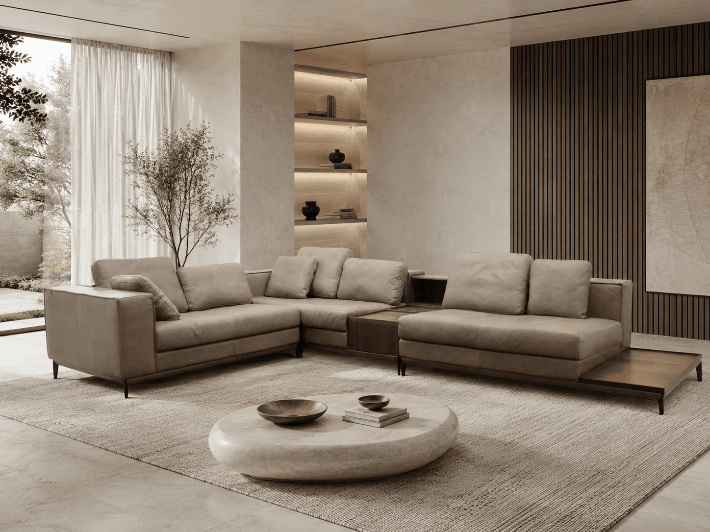 Modern living room with beige sofas, round coffee table, and natural light.