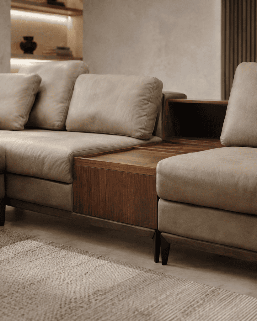 Modern beige sofa with wooden side table in contemporary living room.