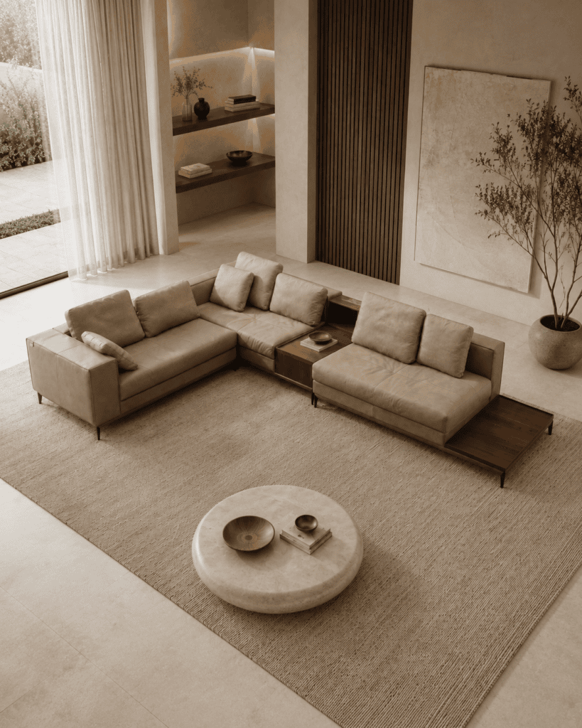Modern living room with beige sofas, wooden coffee table, and neutral decor.