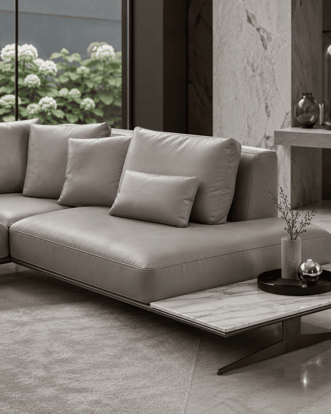 Modern grey sofa with cushions in a stylish living room setting.