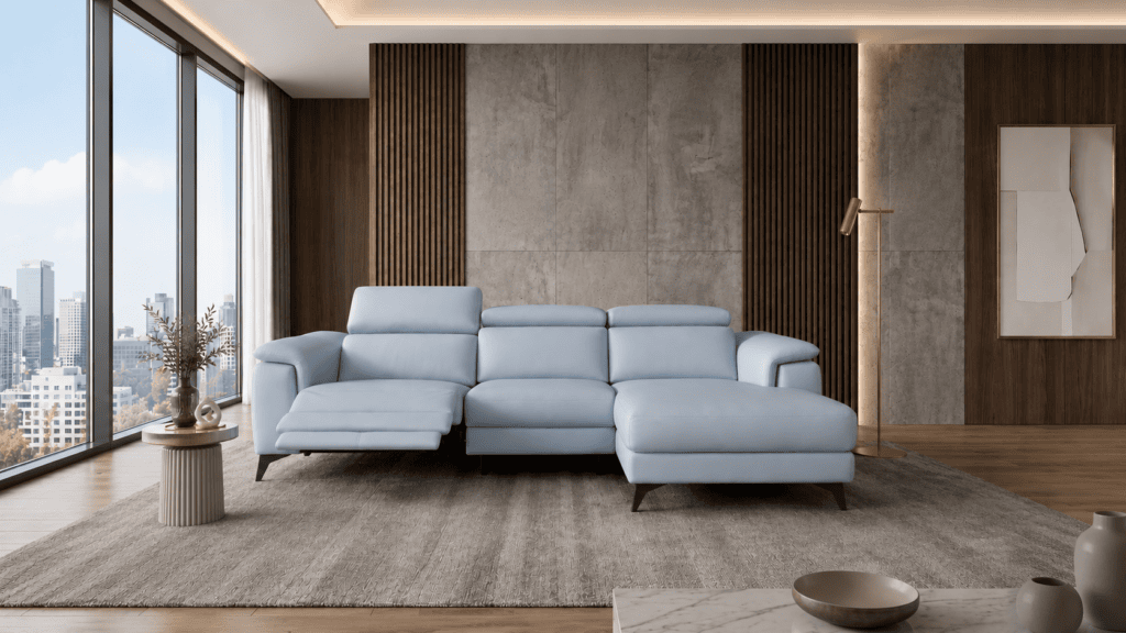 Modern living room with light blue sofa, large windows, and city view.