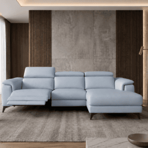 Modern living room with light blue sofa, large windows, and city view.