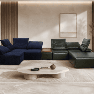Modern living room with navy and green sectional sofas, coffee table, and natural light.