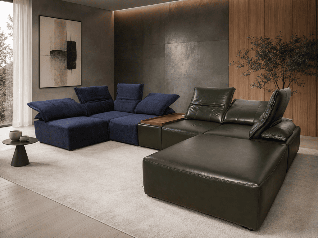 Modern living room with navy and green leather sofas and minimalist decor.