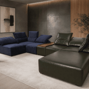 Modern living room with navy and green leather sofas and minimalist decor.