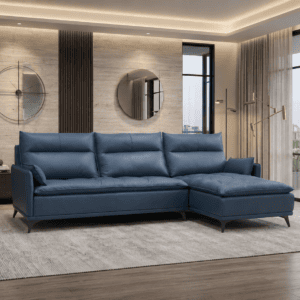 Modern living room with blue sofa, large windows, and city view in the background.