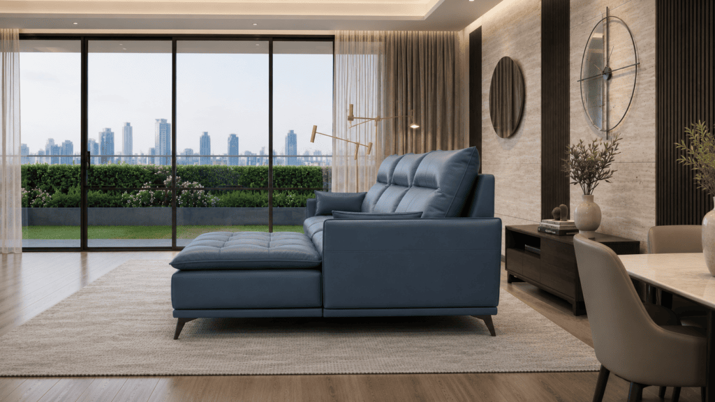 Modern living room with blue sofa, large windows, and city skyline view.