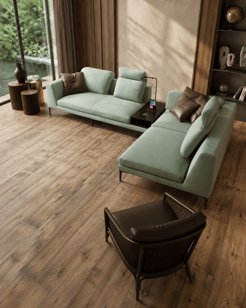 Modern living room with mint green sofas, wooden flooring, and large window view.