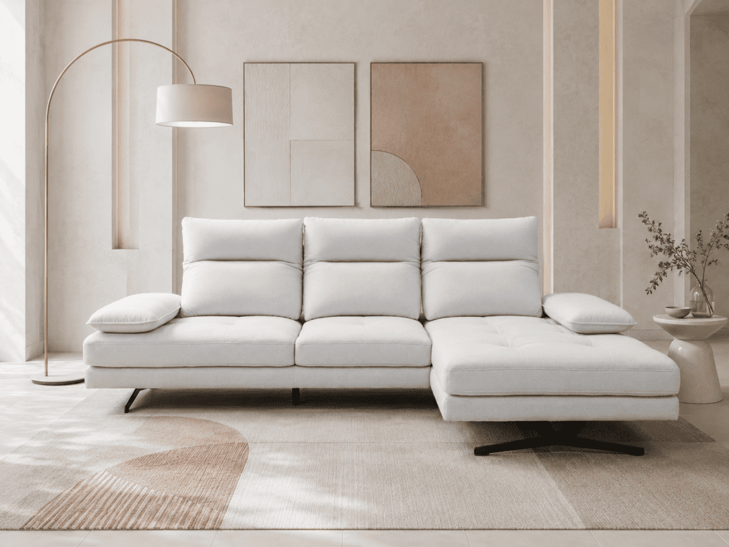 Modern white sofa with cushions in a stylish living room with abstract art.