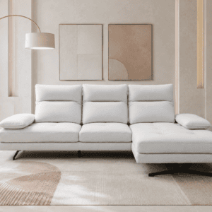 Modern white sofa with cushions in a stylish living room with abstract art.