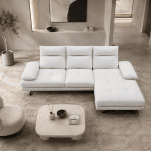Modern white sectional sofa with chaise lounge in stylish living room.