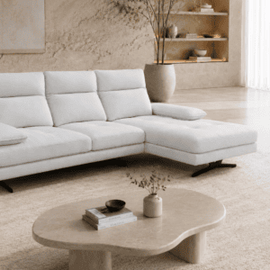 Modern living room with white sofa, beige rug, and minimalist decor.