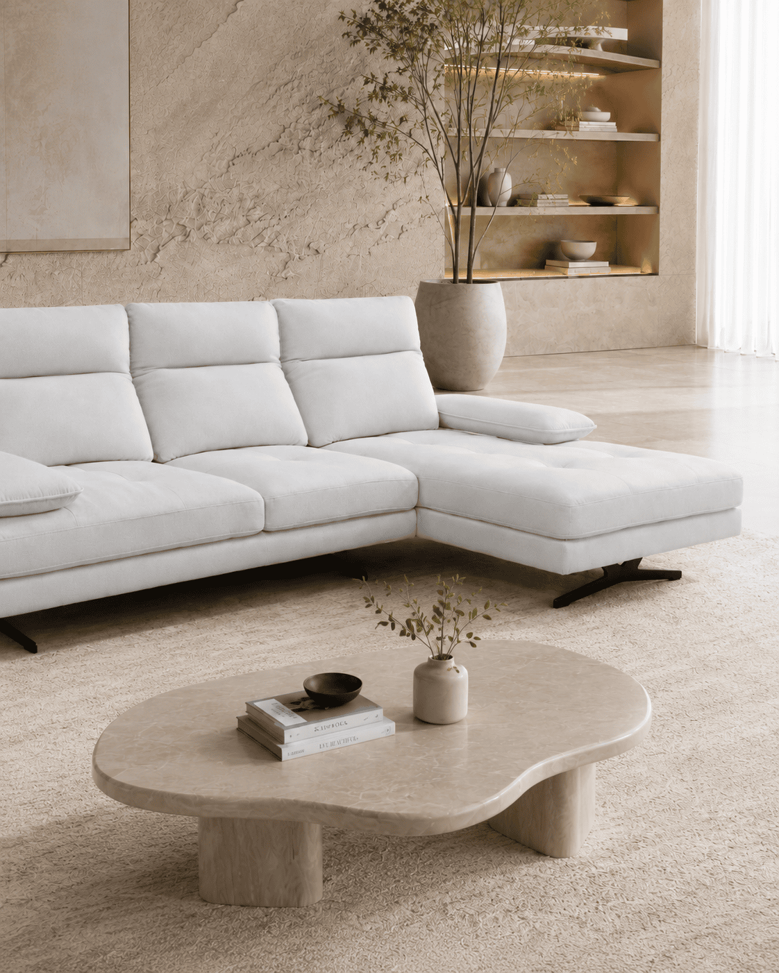 Modern living room with white sofa, beige rug, and minimalist decor.