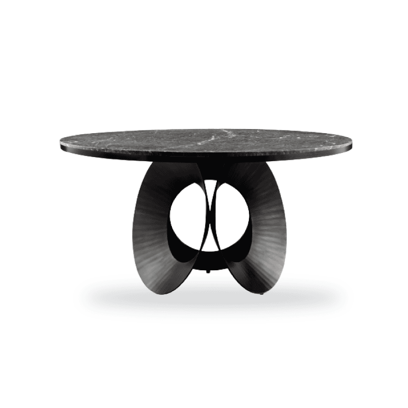 A sleek modern table with a round dark stone top and artistic black metal base.