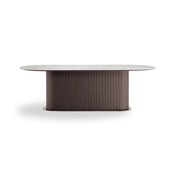 A sleek modern dining table with a rounded white tabletop and dark ribbed base, ideal for contempora.