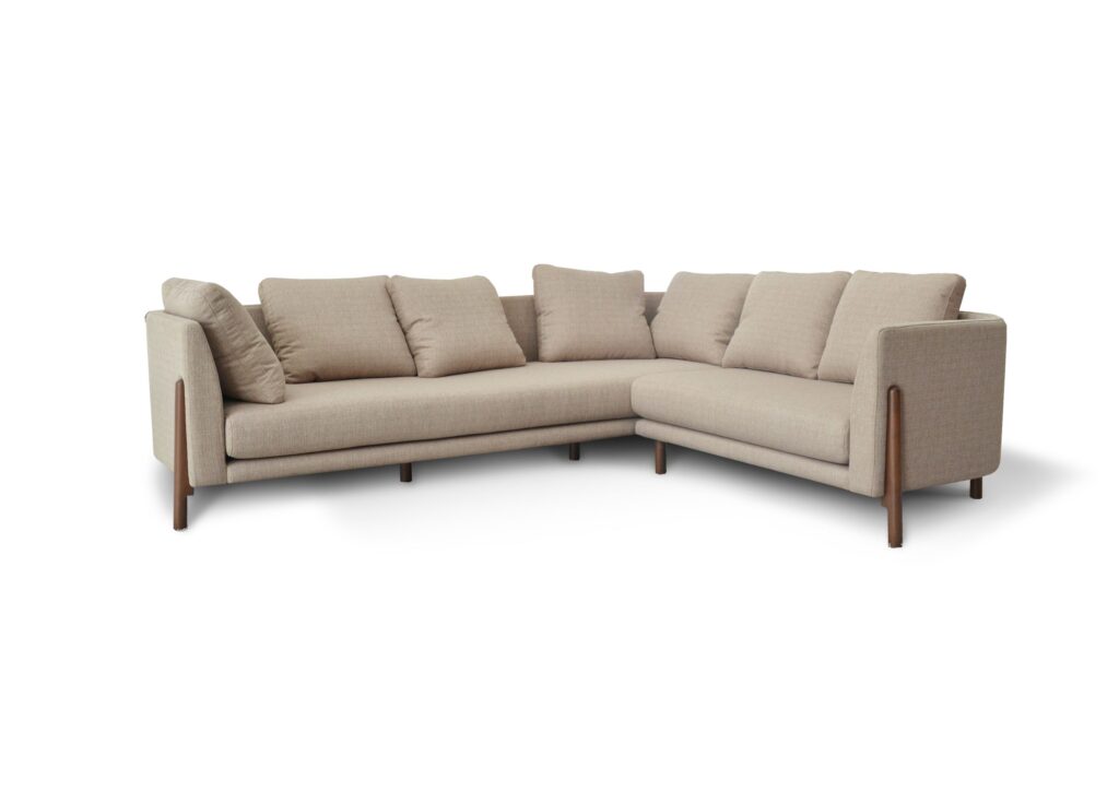 A comfortable beige L-shaped sofa with cushions, ideal for modern living rooms.