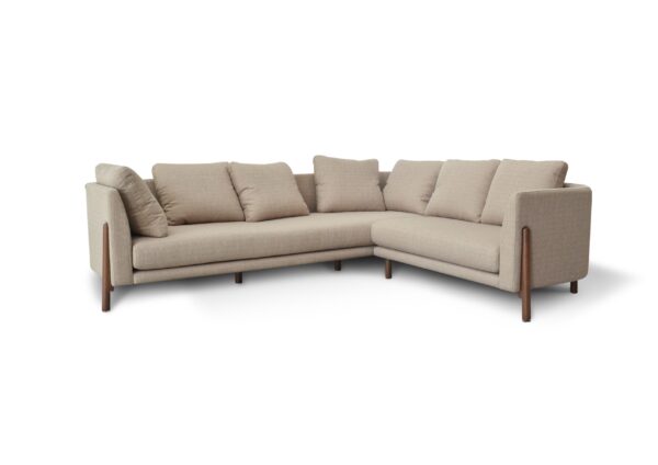 A comfortable beige L-shaped sofa with cushions, ideal for modern living rooms.