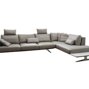 A comfortable grey sectional sofa with cushions and a modern wooden coffee table.