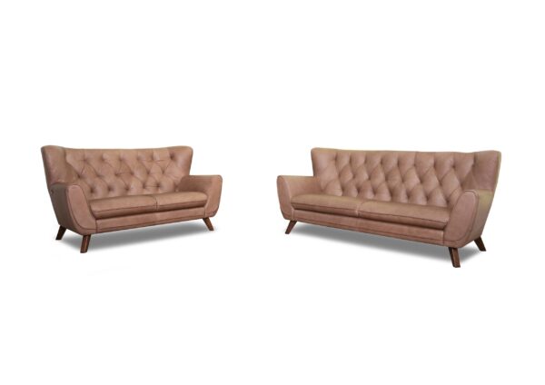 Elegant pink velvet sofas with tufted backrests for stylish living room decor.