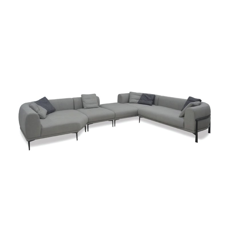 A comfortable modern grey sectional sofa with cushions, ideal for contemporary living rooms.