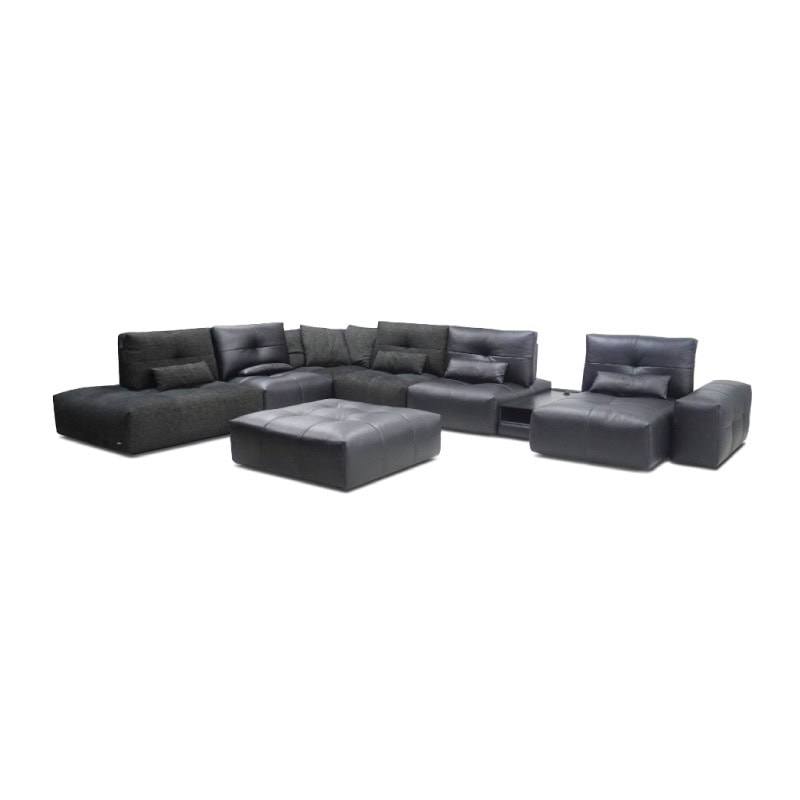 A comfortable black sectional sofa with matching ottoman, modern living room furniture.